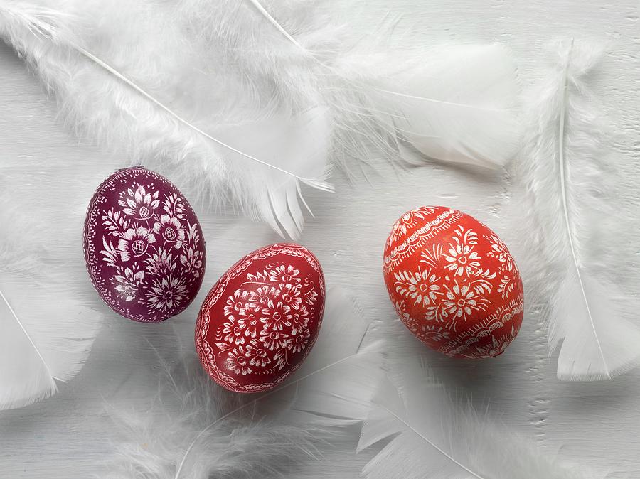 Sorbian Easter Eggs And White Feathers On A White Surface Photograph by Feig & Feig