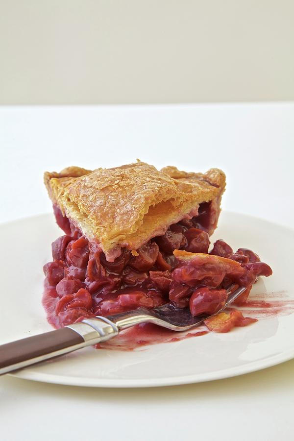 Sour Cherry Pie Sliced On A White Plate Photograph by Andre Baranowski