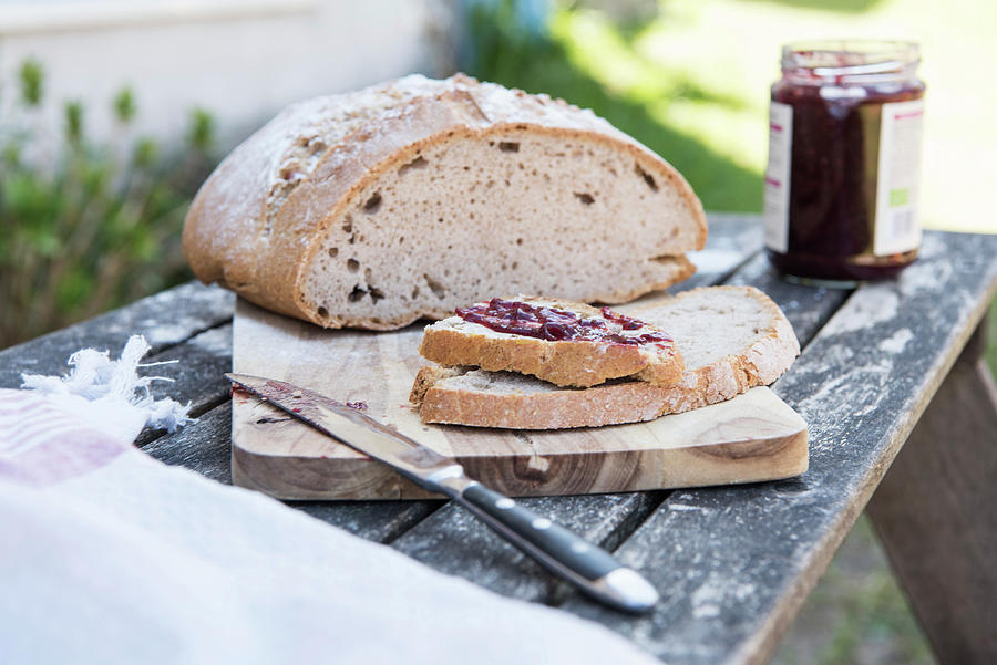 Sour Dough Bread With Butter And Jam On A Table Outside Photograph by Jelena Filipinski