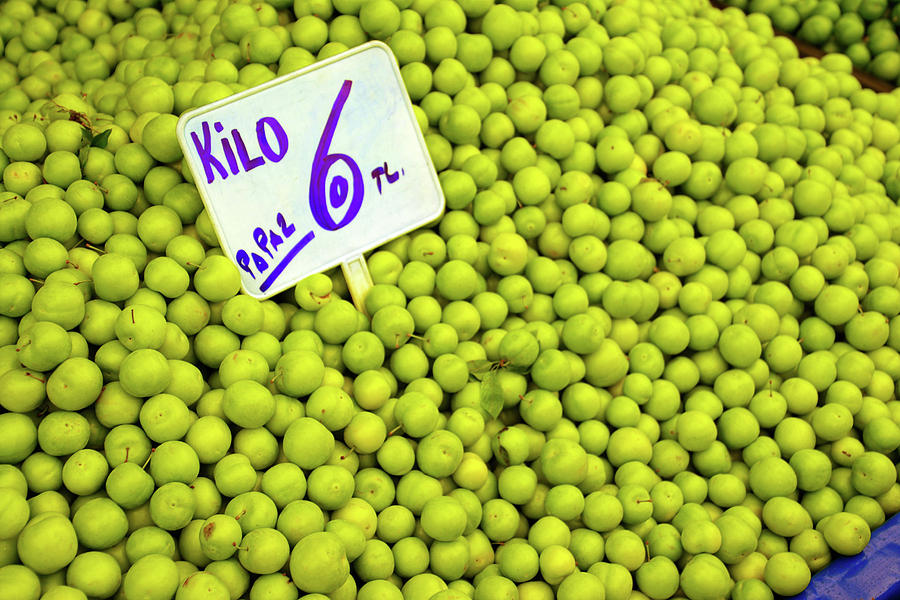 Sour green plums in the central market Photograph by Steve Estvanik