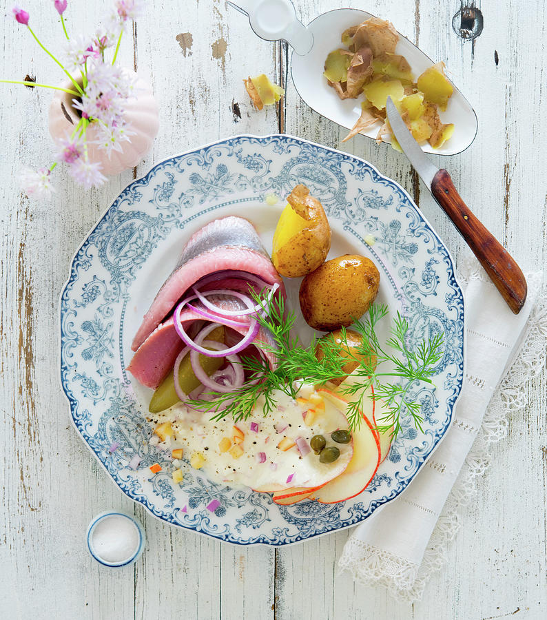 Soused Herring Fillet With New Potatoes And An Apple And Caper Sauce Photograph by Udo Einenkel