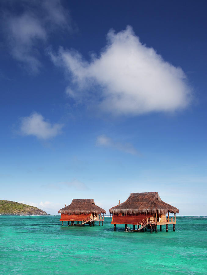 Spa Bungalows In Caribbean Water Shot Photograph by Justin Lewis