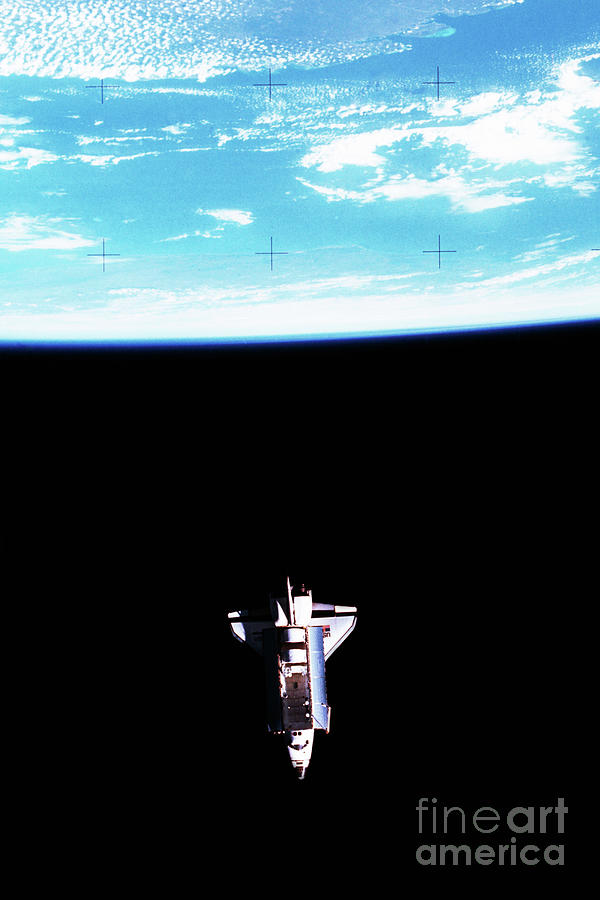 Space Shuttle Challenger Orbiting Earth Photograph by Bettmann