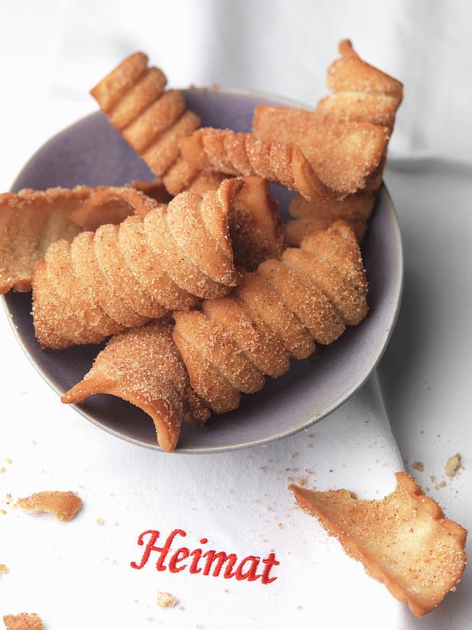 Spagatkrapfen deep-fried Crispy Wafers From Austria With Cinnamon Sugar Photograph by Joerg Lehmann