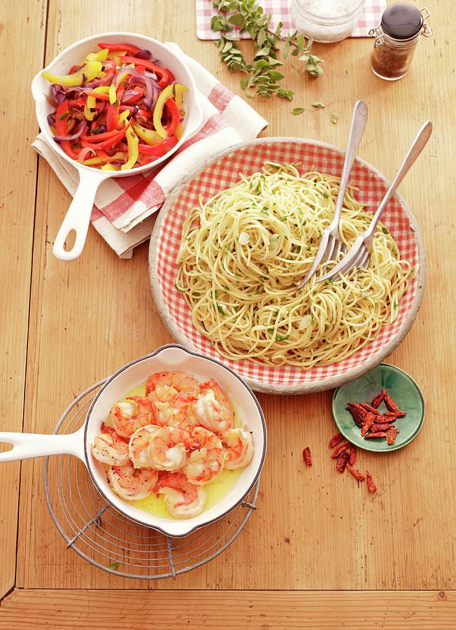 Spaghetti Aglio E Olio With A Pepper Medley And Prawns Photograph by Jalag / Julia Hoersch