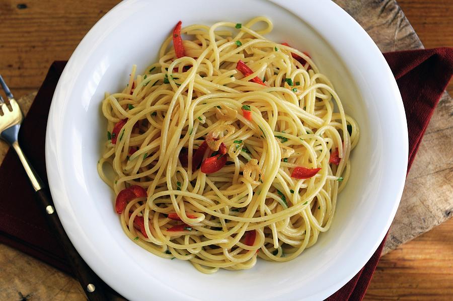 Spaghetti Aglio, Olio E Peperoncino spaghetti With Garlic, Oil And Chilli Peppers Photograph by Mario Matassa