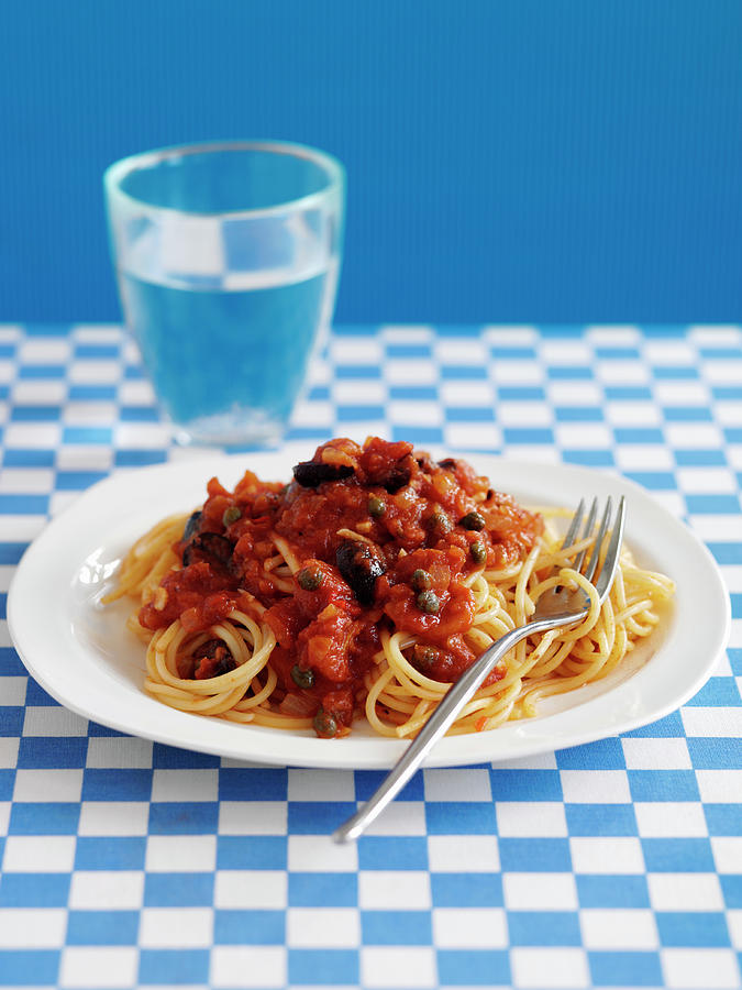 Spaghetti Alla Puttanesca with Tomatoes, Capers And Olives Photograph by Gareth Morgans
