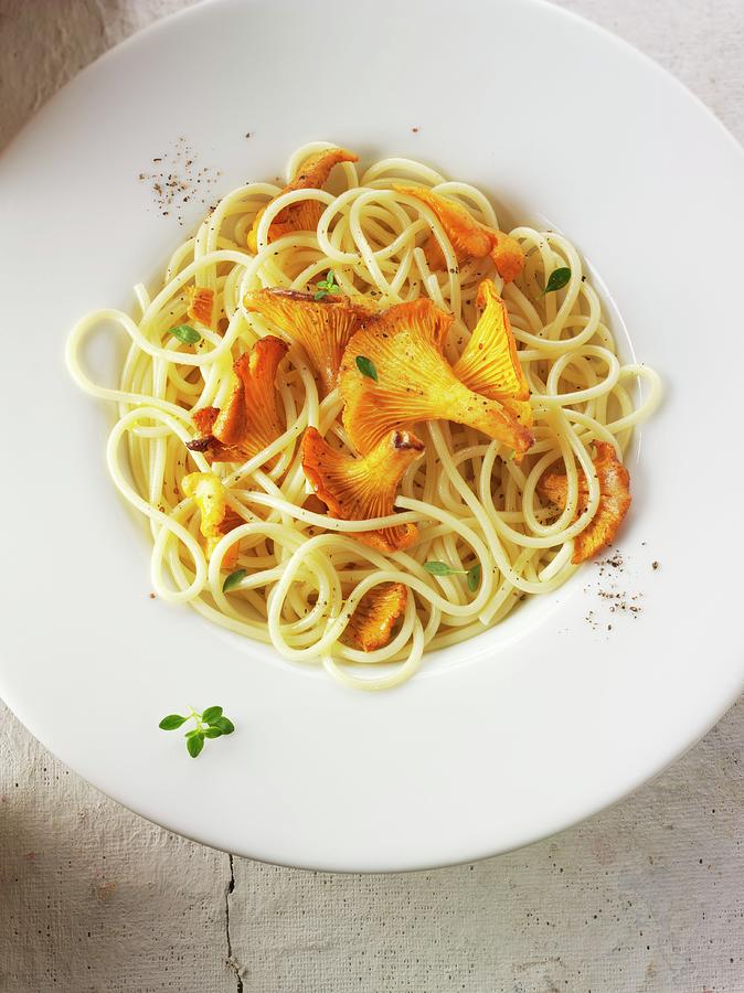 Spaghetti With Chanterelle Mushrooms Sauted In Butter And Herbs Photograph by Paul Williams