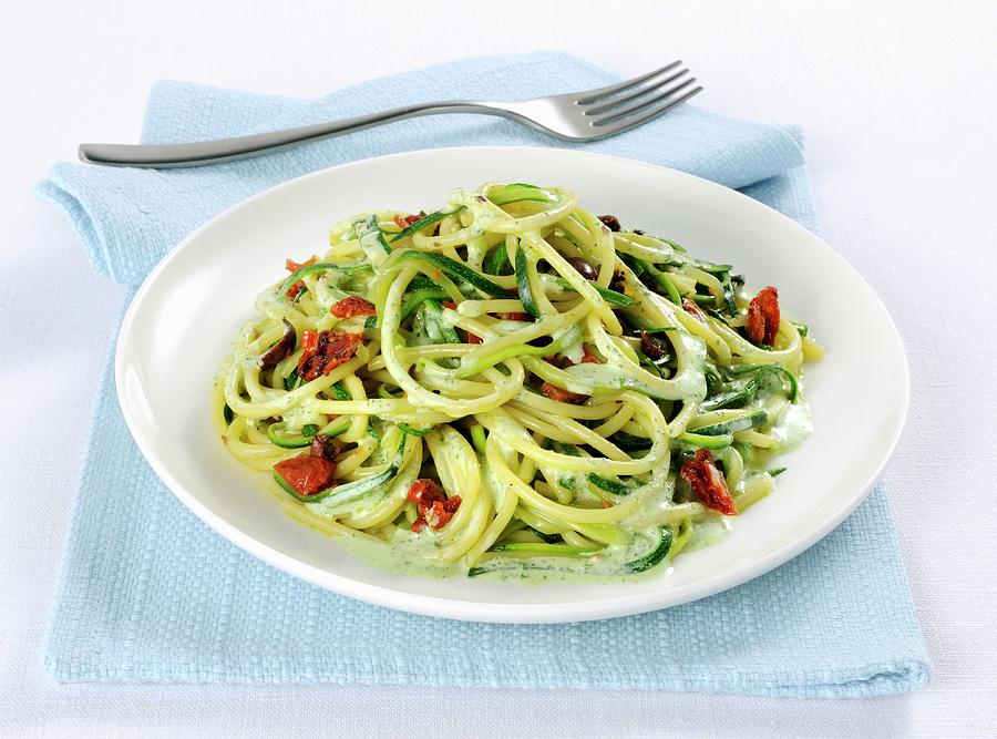Spaghetti With Courgette And Olives Photograph by Franco Pizzochero