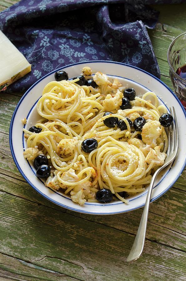 Spaghetti With Roasted Cauliflower And Black Olives Photograph by Aniko Szabo