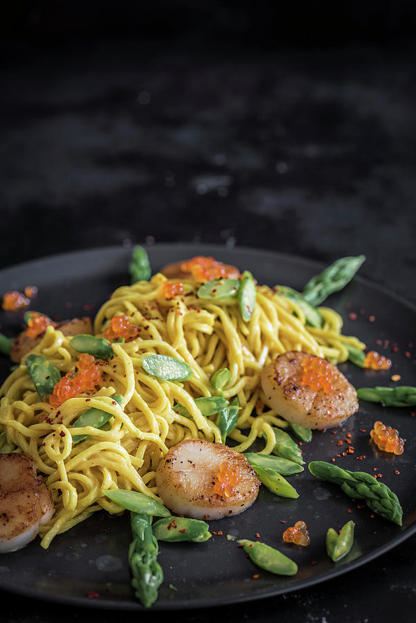 Spaghetti With Saffron Sauce, Scallops, Trout Caviar And Green Asparagus Photograph by M. Nlke