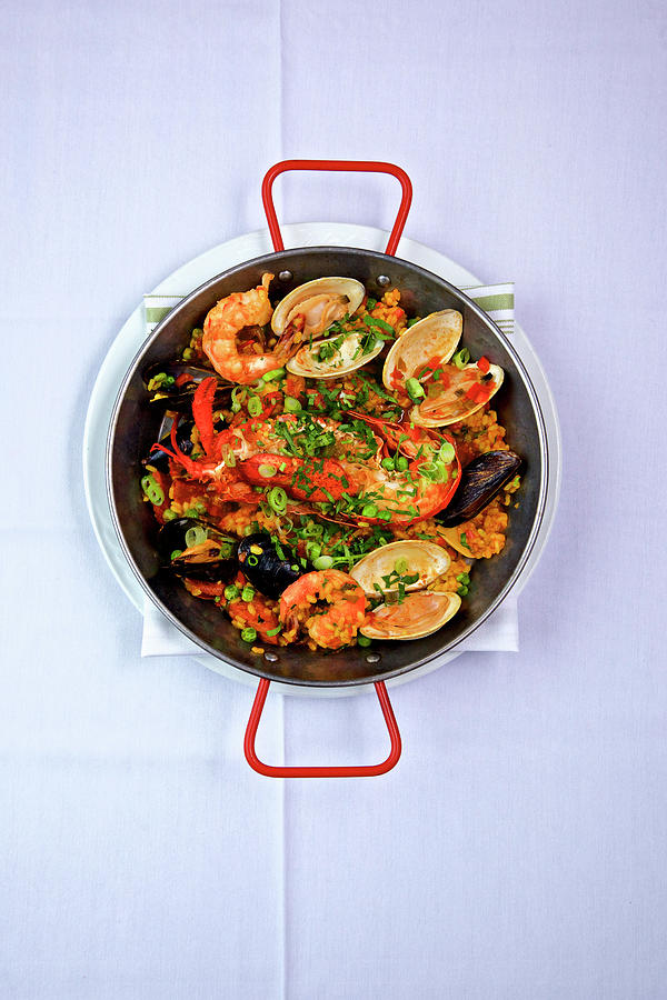 Spanish Paella With Lobster, Clams And Shrimp Photograph by Andre Baranowski