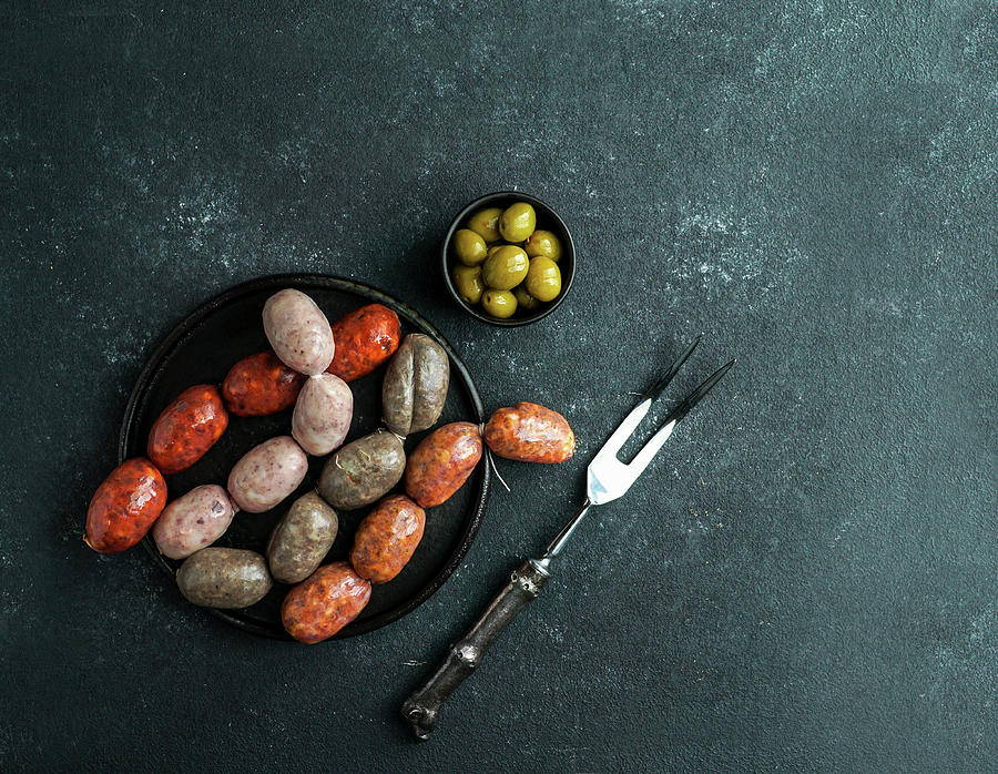 Spanish Sausages On The Cutting Board - Butifarra Blanca, Chorizo, Morcilla De Cebolla Photograph by Julia Bogdanova