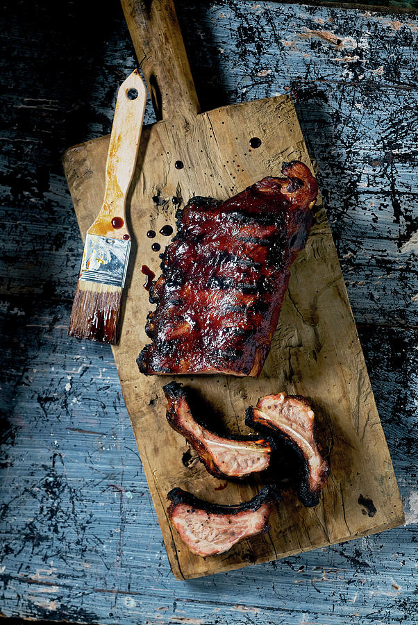 Spare Ribs Glazed On Wooden Cuttingboard Photograph by Arjan Smalen Photography