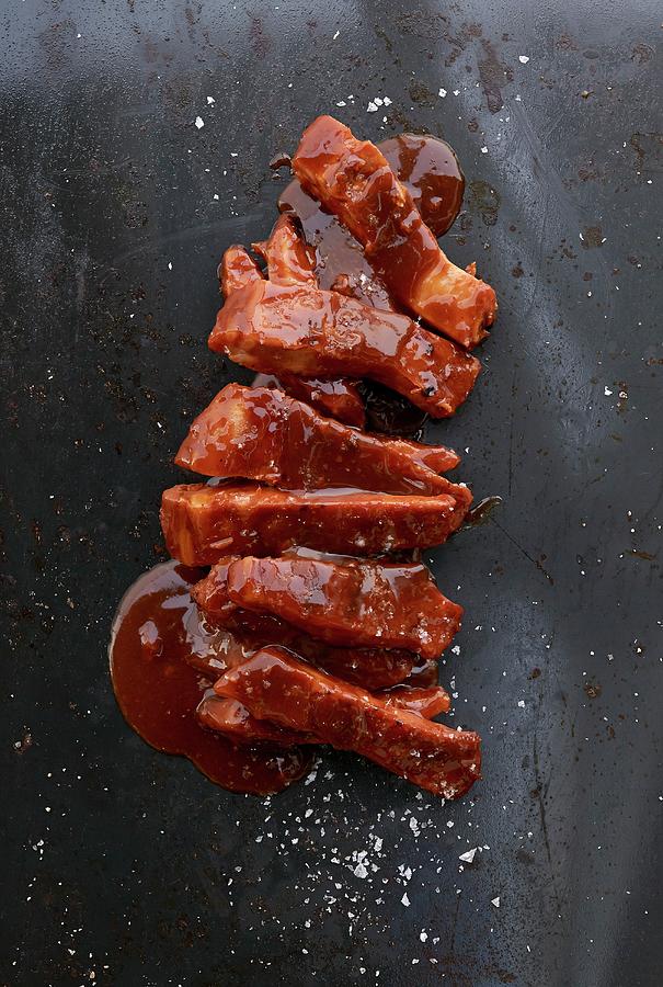 Spare Ribs In Barbecue Sauce Photograph by Robbert Koene