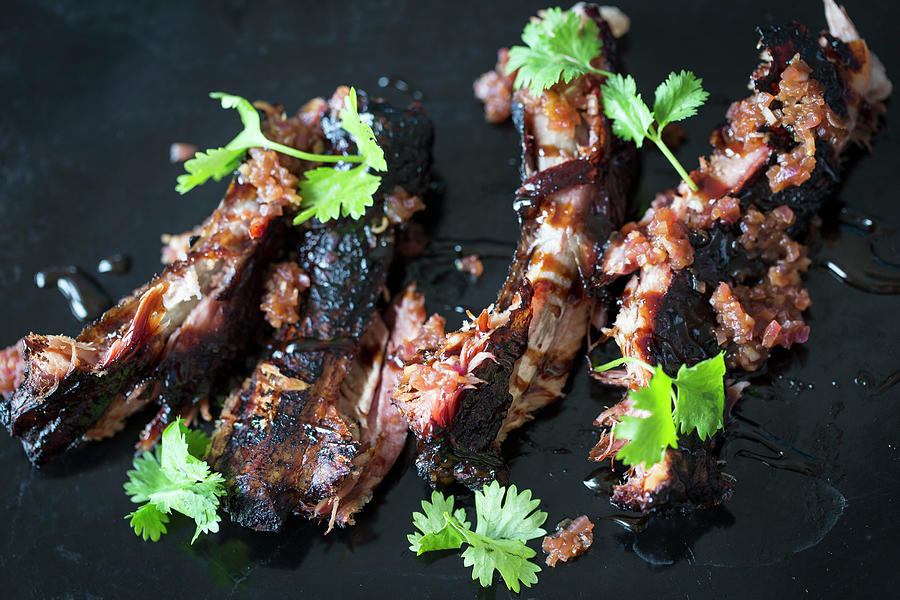 Spare Ribs With An Oriental Marinade And Coriander Photograph by Nicole Godt