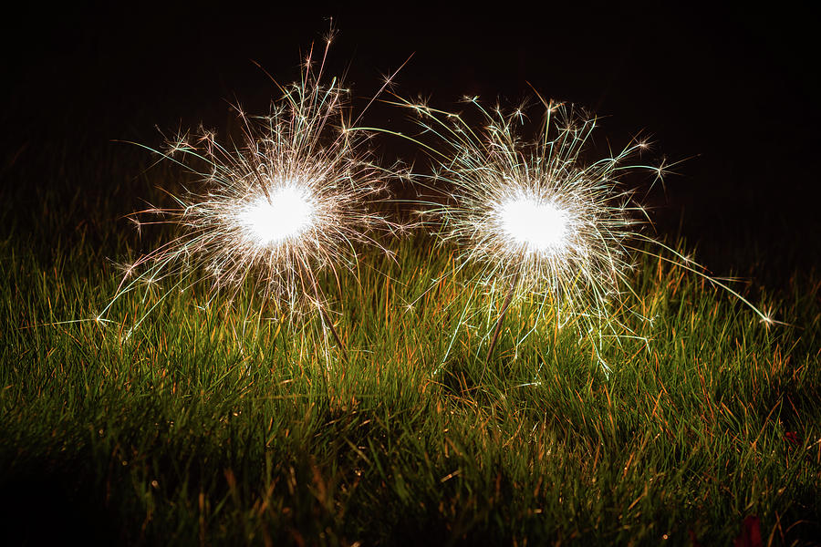 Sparklers in the grass Photograph by Scott Lyons