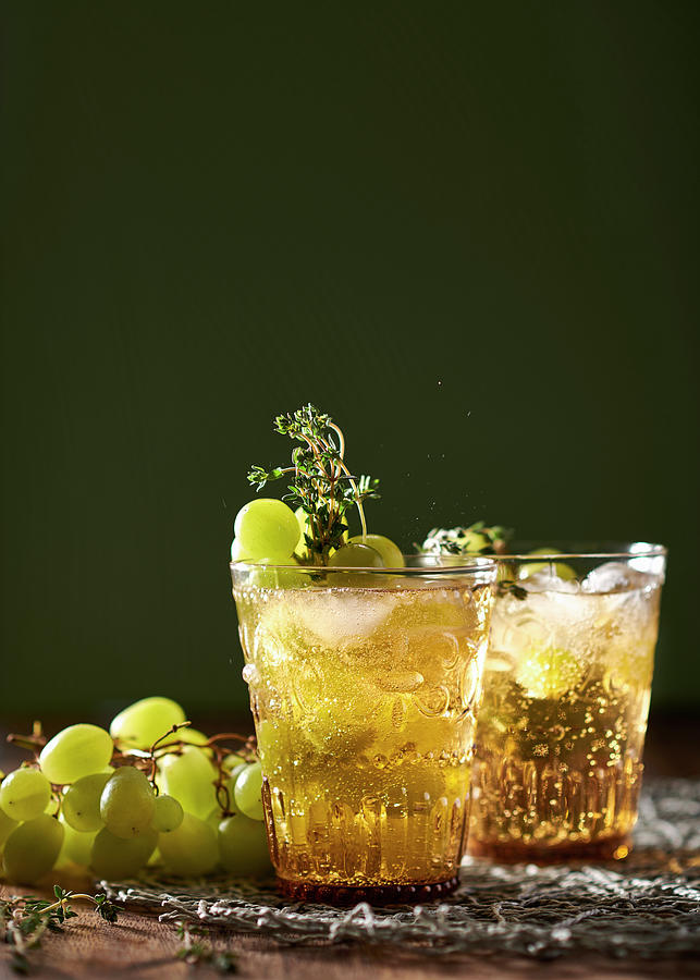 Sparkling Rum, Grape And Thyme Cocktail Photograph by Great Stock!