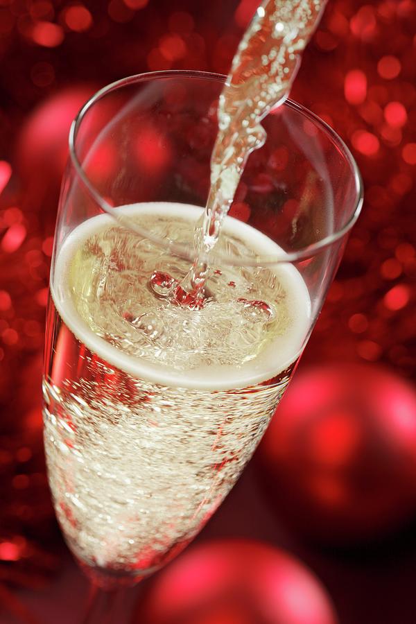 Sparkling Wine Being Poured christmassy Photograph by Krger & Gross