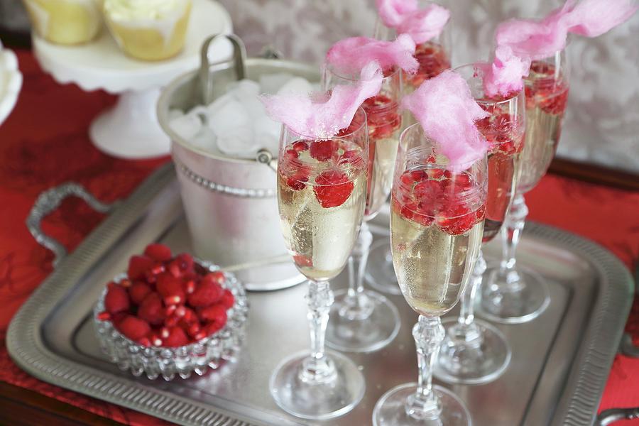 Sparkling Wine With Raspberries, Pomegranate Seeds And Cotton Candy Photograph by Great Stock!