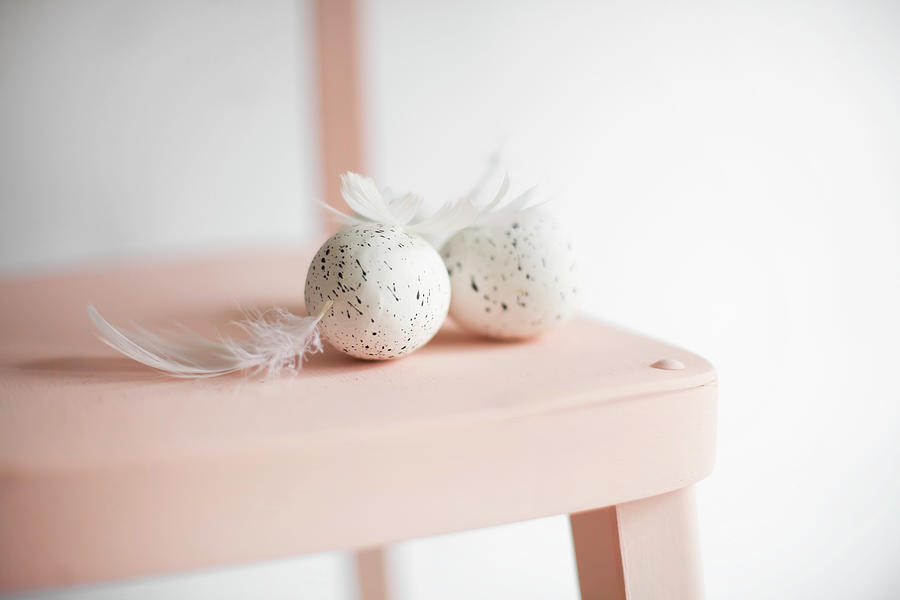 Speckled Eggs And Feathers On Pink Chair Photograph by Alicja Koll