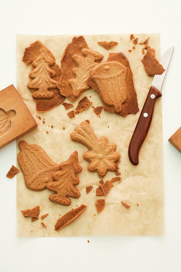 Spekulatius german Christmas Shortcrust Biscuits On Baking Paper With A Wooden Mould And A Knife Photograph by Michael Wissing