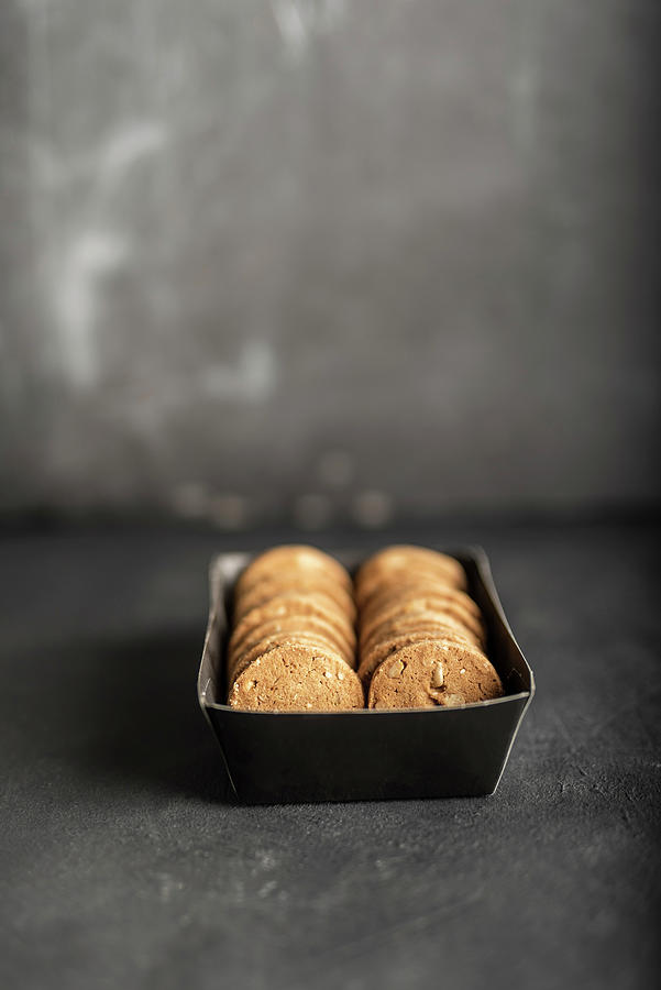 Spelt Cookies With Almonds In A Box Against A Gray Background Photograph by Corina Bouweriks Fotografie