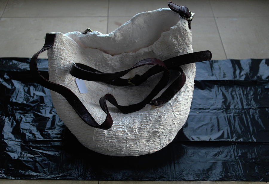 SPENT shell of my sisal bag sculpture in porcelain clay Sculpture by Gloria Ssali