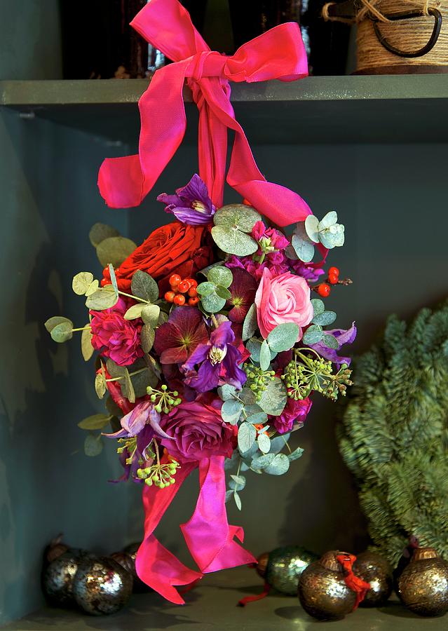 Spherical Flower Arrangement With Roses Tied To Shelf With Silk Ribbon Photograph by Winfried Heinze