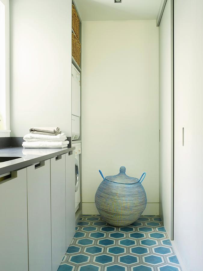 Spherical Laundry Basket With Lid On Patterned Tiled Floor Of Utility