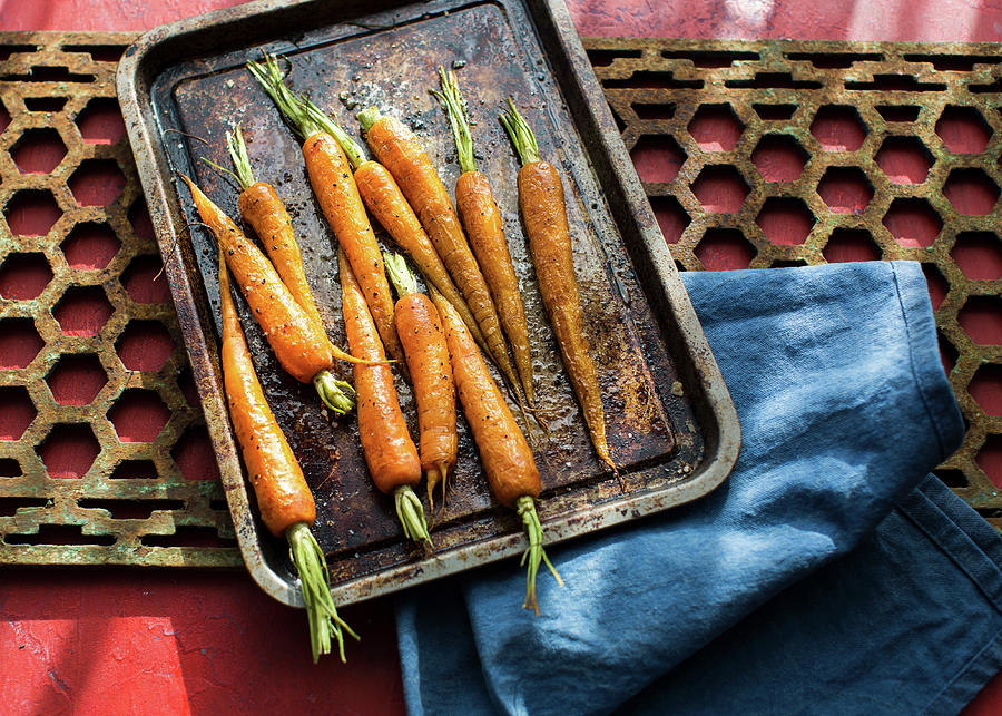 Spiced Carrots On A Baking Sheet Photograph by Lara Jane Thorpe