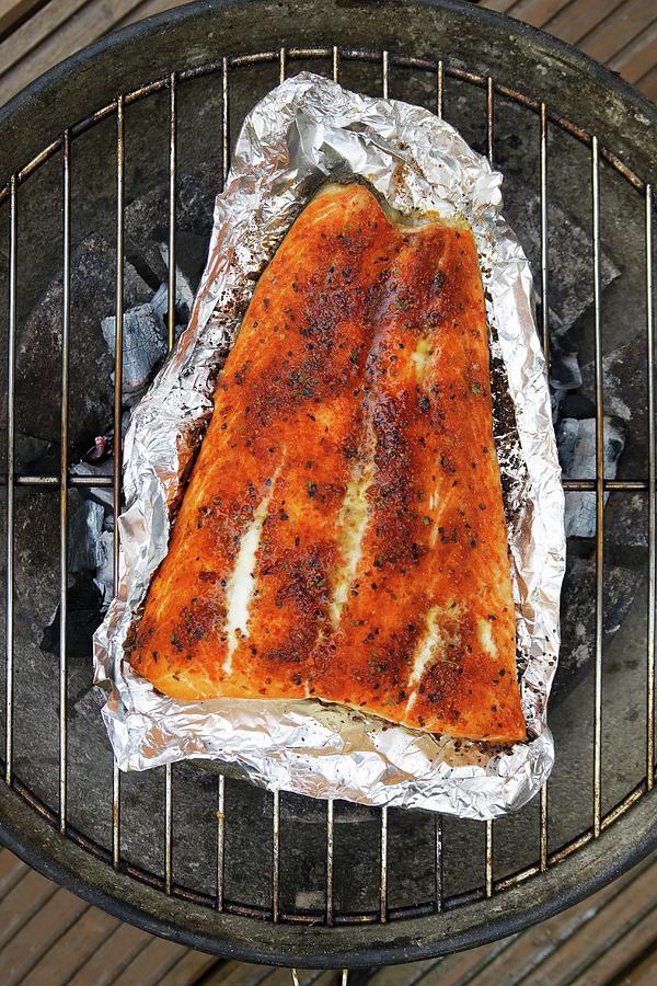 Spiced Salmon In Aluminium Foil On A Barbecue Photograph by Petr Gross
