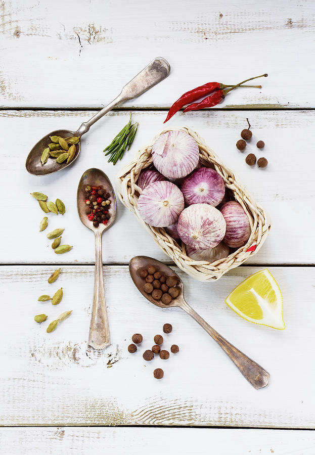 Spices, Herbs And Garlic On A White Wooden Surface seen From Above Photograph by Yuliya Gontar