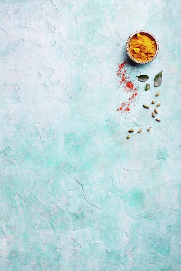 Spices On A Blue Surface Photograph by Tim Atkins Photography