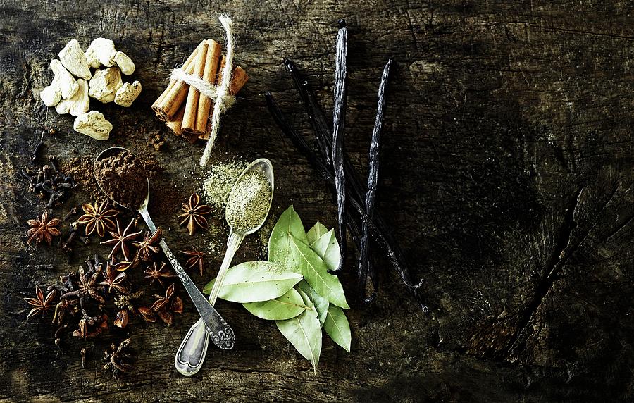 Spices On A Piece Of Wood Photograph by Mikkel Adsbl