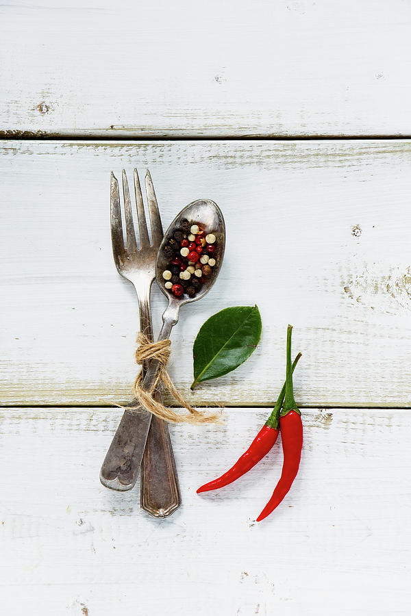 Spices, Red Hot Chili Peppers With Vintage Fork And Spoon On White Wooden Background Photograph by Yuliya Gontar