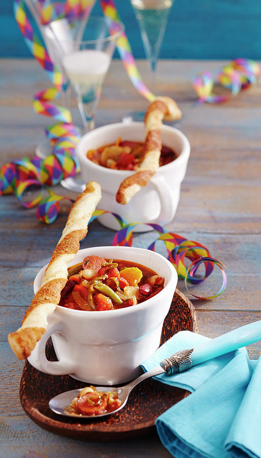 Spicy Bean Soup With Sausages Served With Yeast Dough And Puff Pastry Parmesan Sticks Photograph by Teubner Foodfoto
