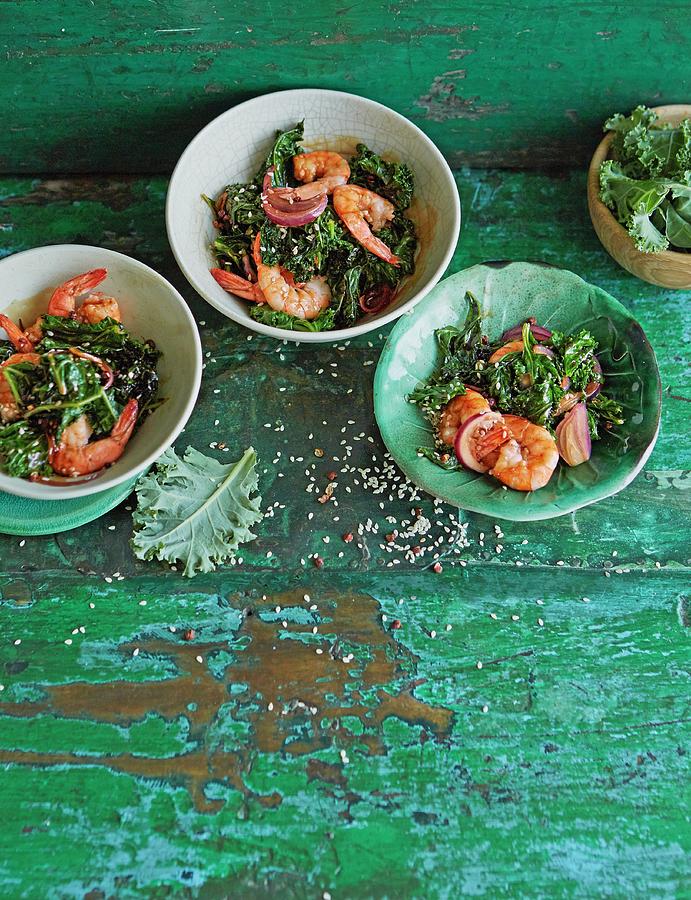 Spicy Garlic Prawns With Chilli Flakes, Orange Zest And Green Kale Photograph by Jalag / Julia Hoersch