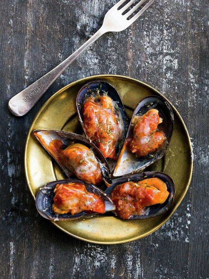 Spicy Gratinated Mussels On A Gold-coloured Plate Photograph by Taste Agencia Gastronmica