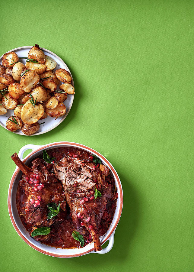 Spicy Leg Of Lamb With Pomegranate Seeds And Baby Potatoes Photograph by Great Stock!