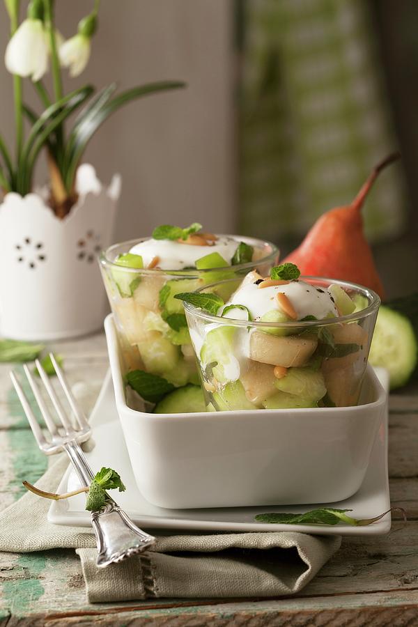 Spicy Pear And Cucumber Salad With Peppermint, Pine Nuts And Yogurt Sauce Photograph by Blueberrystudio