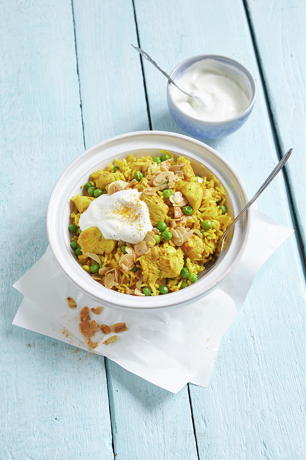 Spicy Pilaf With Chicken, Peas, And Almonds Photograph by Oliver Stockfood Studios / Brachat