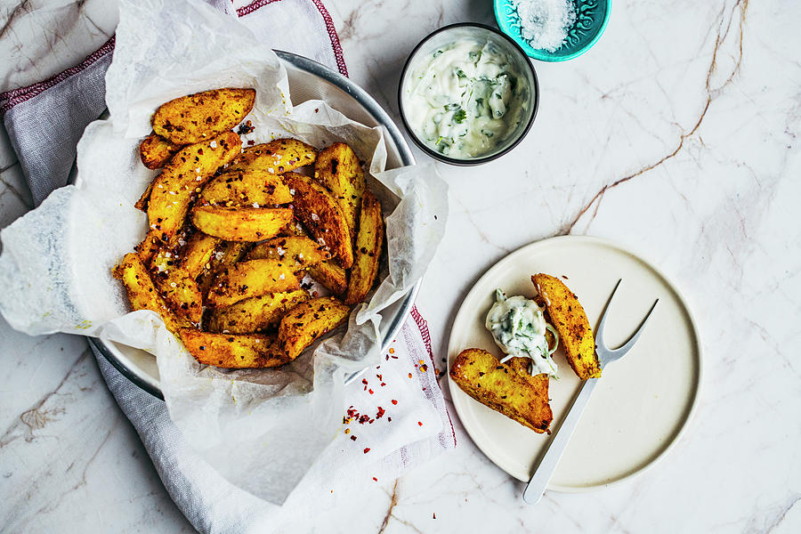 Spicy Potato Wedges From A Pressure Cooker Served With A Dip Photograph by Hein Van Tonder
