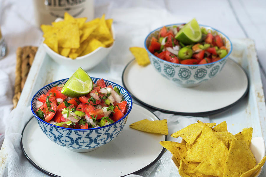 Spicy Tomato Salsa With Tortilla Chips Photograph by Mateja Zvirotic
