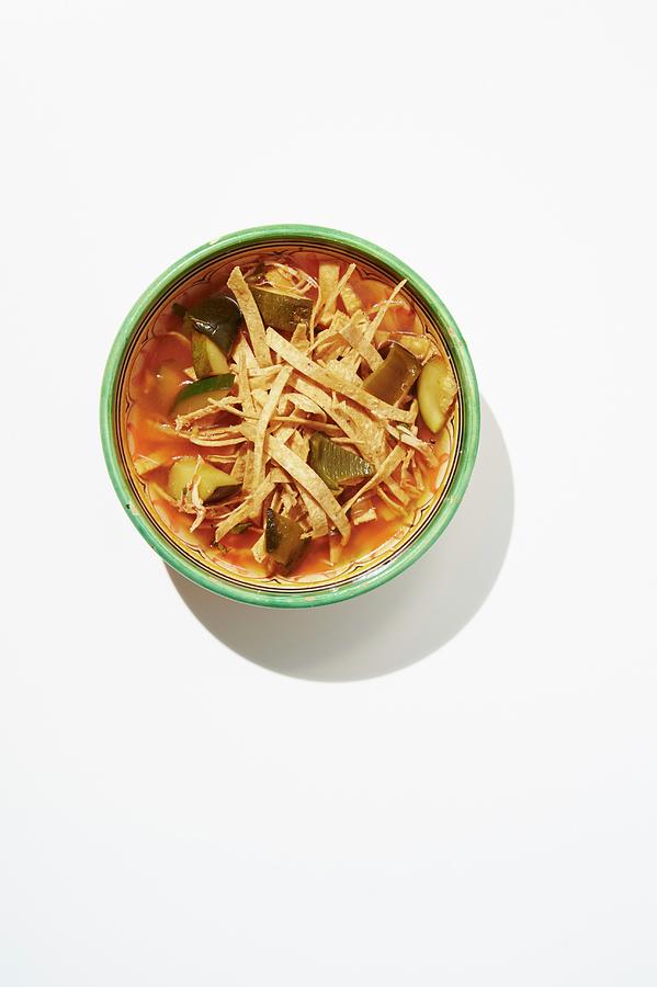 Spicy Tortilla Soup With Chicken Stock, Tortilla Strips, Chicken, Roasted Vegetables And Coriander Photograph by Greg Rannells