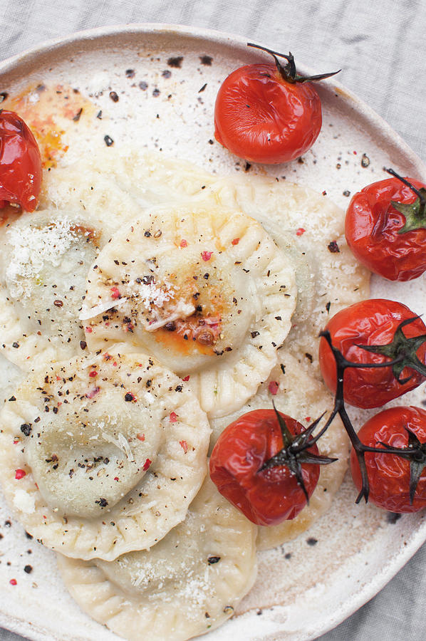 Spinach And Mascarpone Ravioli Served With Roasted Cherry Tomatoes, Grated Parmesan And Ground Black Pepper Photograph by Kachel Katarzyna