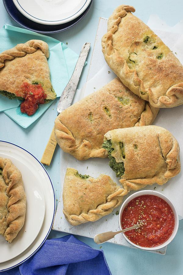 Spinach And Ricotta Calzone With Tomato Sauce Photograph by Zuzanna Ploch