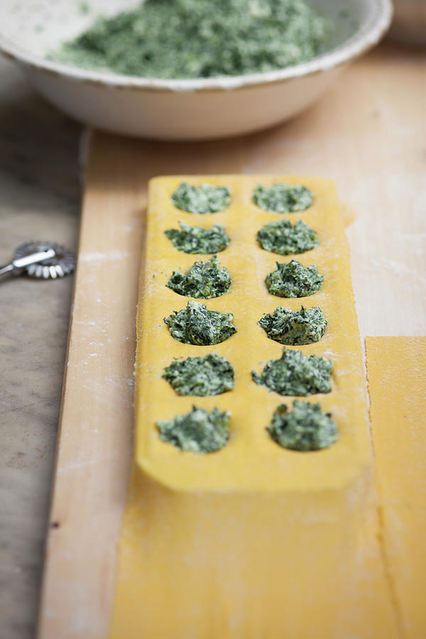 Spinach And Ricotta Ravioli Being Made Photograph by Eising Studio