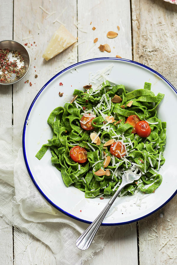 Spinach Pasta With Tomato, Parmesan And Toasted Almonds Photograph by Stacy Grant