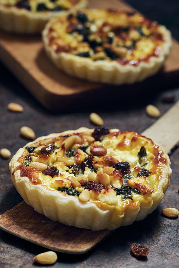 Spinach Pie With Sheeps Cheese, Raisins And Pine Nuts Photograph by Ulrike Emmert